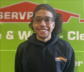 Photo of male SERVPRO employee with a green background