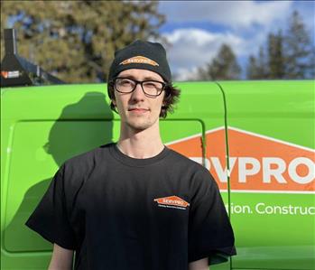 Photo of male SERVPRO employee with a green background